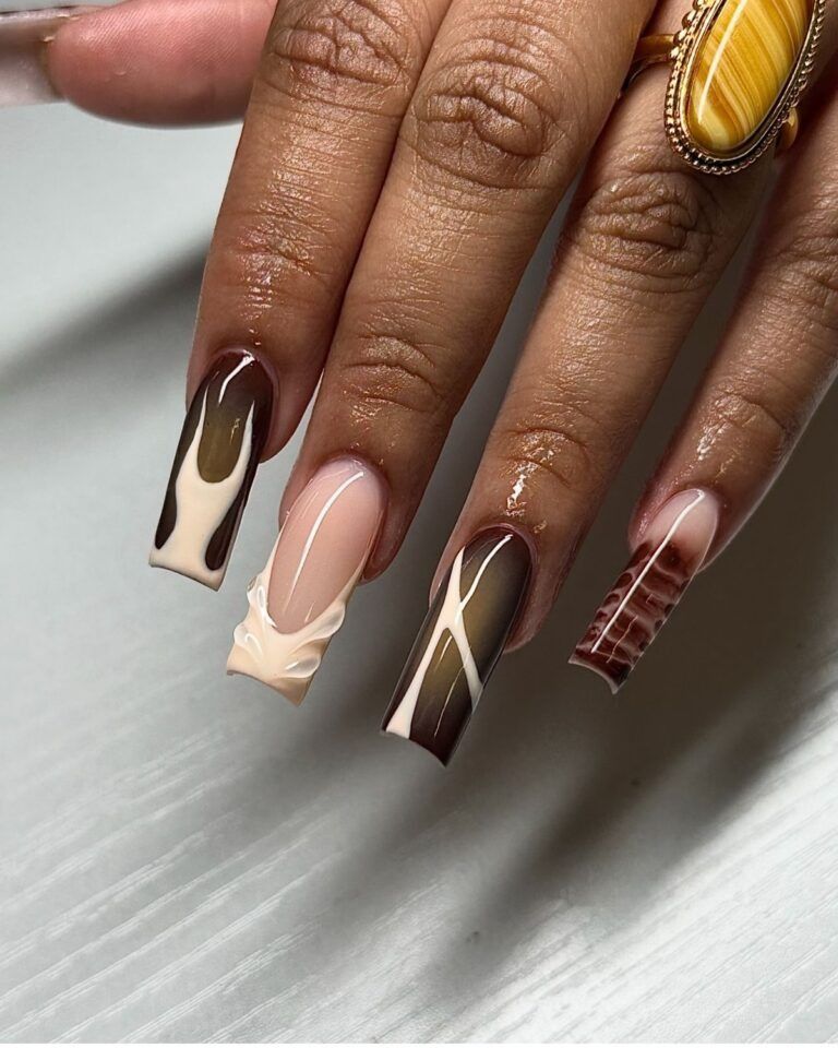Brown abstract art long square nails in chocolate and cream waves with a statement tiger eye ring